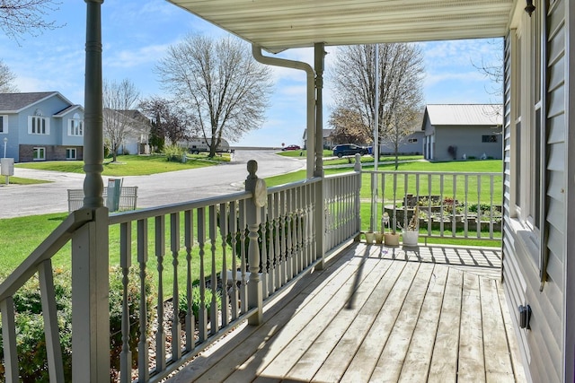 155 Nicholas Dr, Lewiston, MN 55952 - wooden porch featuring a residential view and a yard