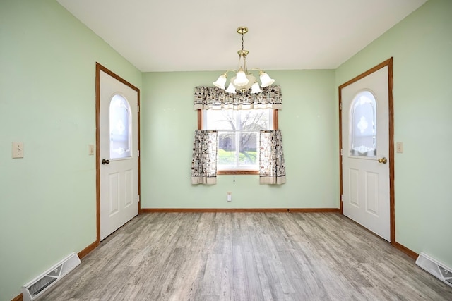 155 Nicholas Dr, Lewiston, MN 55952 - foyer with a chandelier and wood finished floors