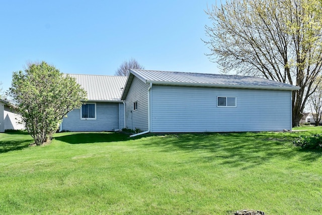 155 Nicholas Dr, Lewiston, MN 55952 - back of property with a lawn and a metal roof
