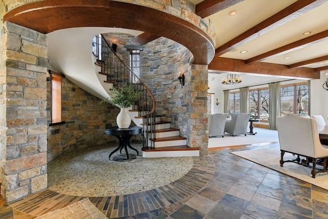12535 Beach Cir, Eden Prairie, MN 55344 - stairs featuring beamed ceiling, arched walkways, recessed lighting, and a chandelier