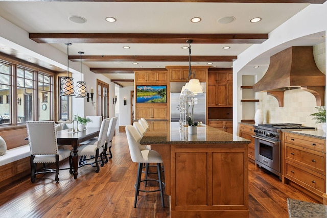 12535 Beach Cir, Eden Prairie, MN 55344 - kitchen featuring high end appliances, dark wood-style floors, premium range hood, beam ceiling, and brown cabinetry