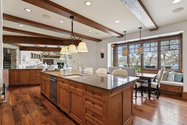12535 Beach Cir, Eden Prairie, MN 55344 - kitchen with dark wood finished floors, brown cabinetry, beam ceiling, and a sink