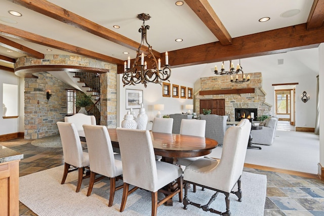 12535 Beach Cir, Eden Prairie, MN 55344 - dining area featuring a stone fireplace, beam ceiling, baseboards, and a notable chandelier