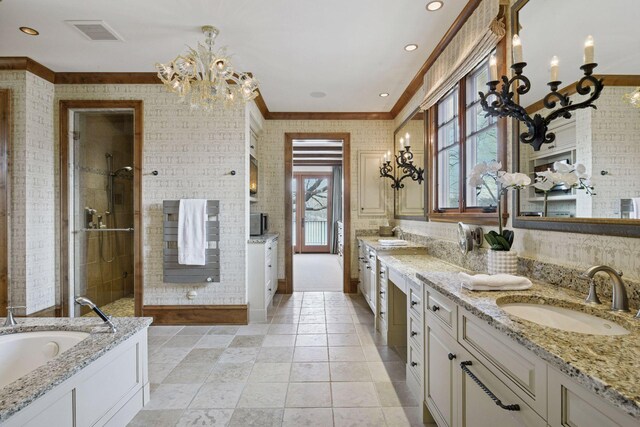 12535 Beach Cir, Eden Prairie, MN 55344 - bathroom with an inviting chandelier, visible vents, a sink, two vanities, and a stall shower