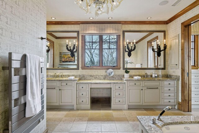 12535 Beach Cir, Eden Prairie, MN 55344 - full bathroom with ornamental molding, a sink, a chandelier, and double vanity