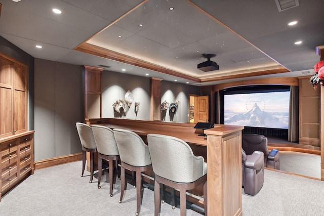 12535 Beach Cir, Eden Prairie, MN 55344 - home theater room featuring light colored carpet, baseboards, a bar, and a tray ceiling