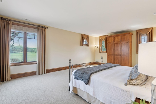 12535 Beach Cir, Eden Prairie, MN 55344 - bedroom featuring light colored carpet, baseboards, and visible vents