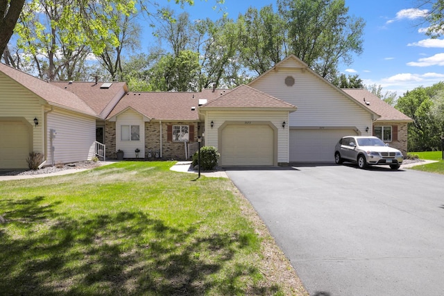 2672 Lake Court Dr Unit 58, Mounds View, MN 55112 - ranch-style house featuring a garage, asphalt driveway, a front yard, and brick siding