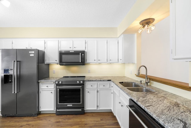 2672 Lake Court Dr Unit 58, Mounds View, MN 55112 - kitchen with refrigerator with ice dispenser, stainless steel range with electric stovetop, a sink, dishwasher, and white cabinetry