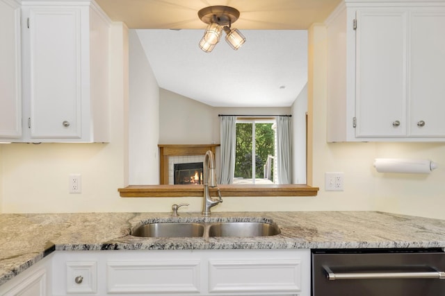 2672 Lake Court Dr Unit 58, Mounds View, MN 55112 - kitchen featuring dishwasher, a sink, white cabinets, lofted ceiling, and ceiling fan