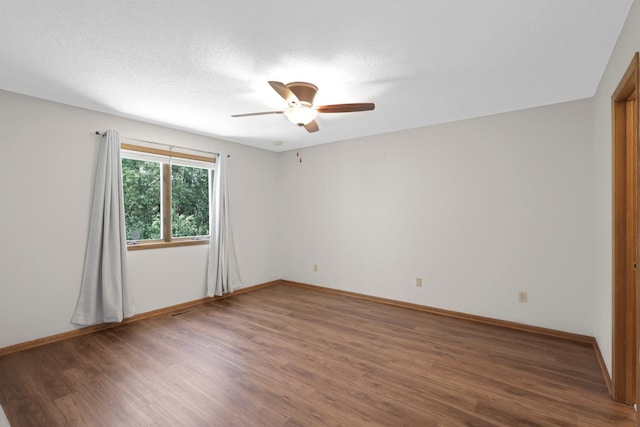2672 Lake Court Dr Unit 58, Mounds View, MN 55112 - spare room with wood finished floors, a ceiling fan, and baseboards