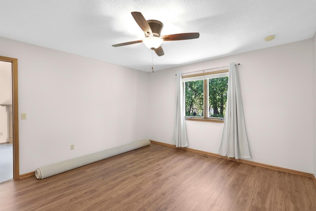 2672 Lake Court Dr Unit 58, Mounds View, MN 55112 - unfurnished room featuring wood finished floors, ceiling fan, baseboards, and a smoke detector