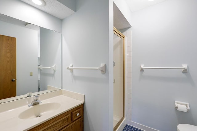 2672 Lake Court Dr Unit 58, Mounds View, MN 55112 - bathroom featuring toilet, a shower stall, tile patterned flooring, vanity, and baseboards