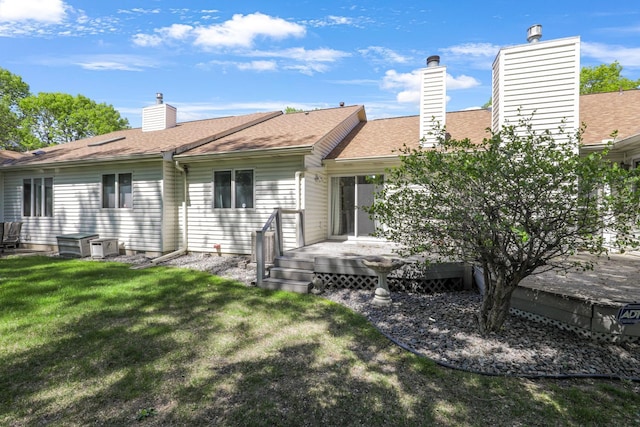 2672 Lake Court Dr Unit 58, Mounds View, MN 55112 - rear view of house with a yard, a chimney, and a deck