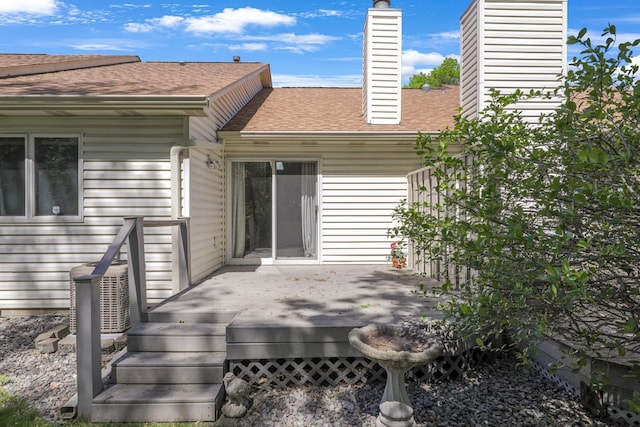 2672 Lake Court Dr Unit 58, Mounds View, MN 55112 - rear view of property featuring a chimney, a shingled roof, and a wooden deck