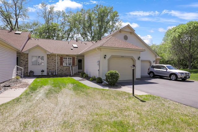 2672 Lake Court Dr Unit 58, Mounds View, MN 55112 - single story home with an attached garage, driveway, roof with shingles, a front yard, and brick siding