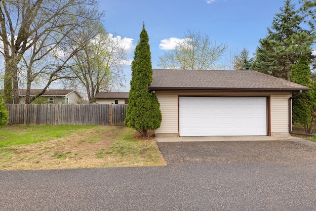 detached garage with fence