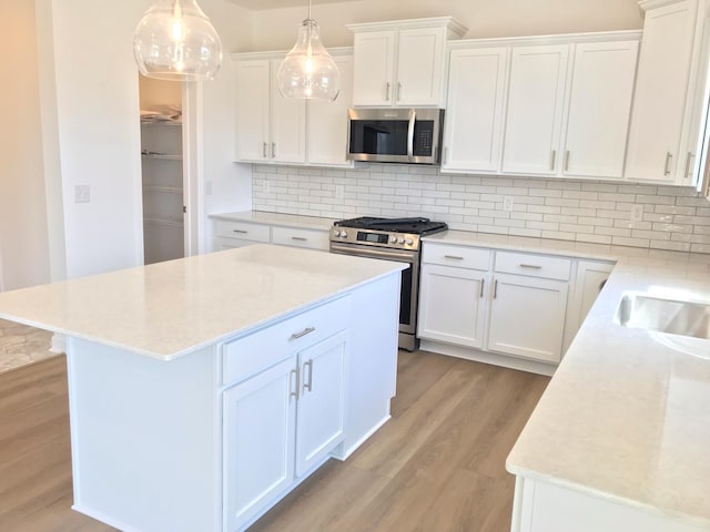 613 Rolling Hills Ln, Delano, MN 55328 - kitchen featuring stainless steel appliances, light countertops, and light wood finished floors
