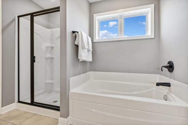 613 Rolling Hills Ln, Delano, MN 55328 - bathroom with a shower stall, a bath, and tile patterned flooring