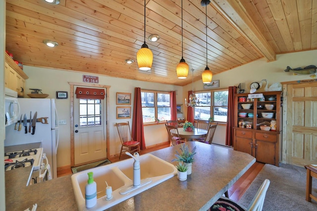 dining space featuring wooden ceiling and lofted ceiling