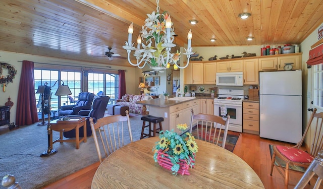 dining space with wooden ceiling, wood finished floors, a chandelier, and a ceiling fan