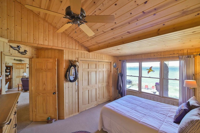 carpeted bedroom with wooden walls and wooden ceiling