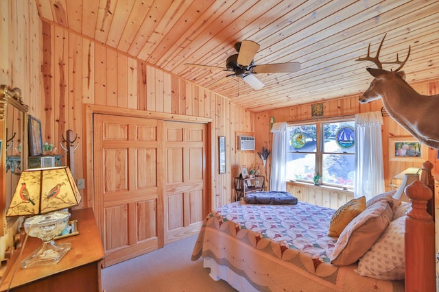 carpeted bedroom featuring wood walls, wood ceiling, a wall mounted AC, a closet, and vaulted ceiling
