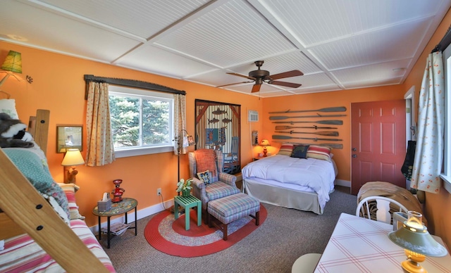 bedroom with carpet, baseboards, coffered ceiling, and ceiling fan