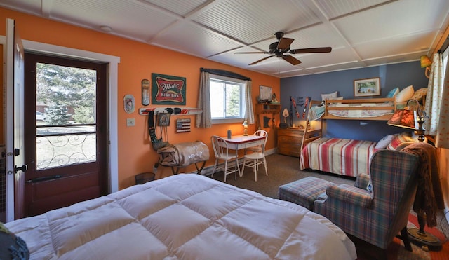 bedroom with carpet floors, coffered ceiling, baseboards, ceiling fan, and access to exterior