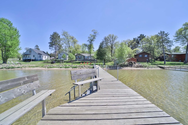dock with a water view and a residential view