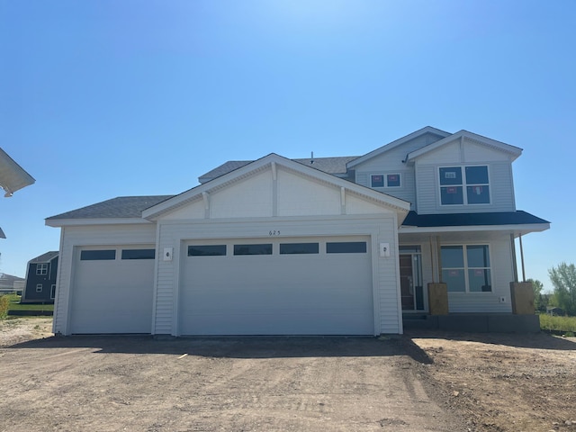625 Rolling Hills Ln, Delano, MN 55328 - view of front of house featuring an attached garage, a porch, and dirt driveway