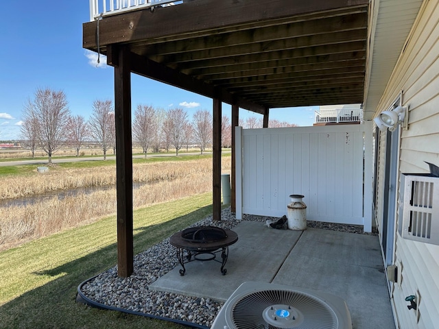 4129 Jarmann Ln, Shakopee, MN 55379 - view of patio featuring a fire pit and cooling unit