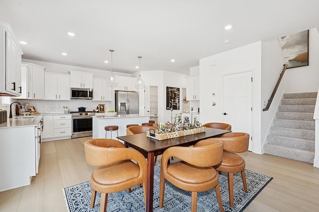 529 Rolling Hills Ln, Delano, MN 55328 - dining space with stairs, light wood-style floors, and recessed lighting