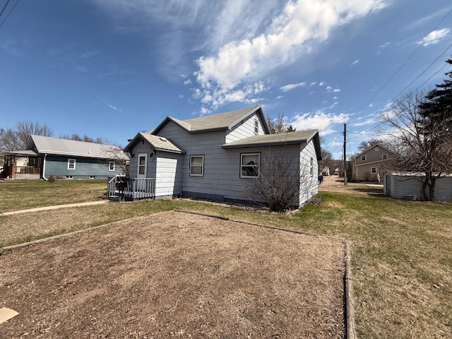 128 Munsterman St, Appleton, MN 56208 - rear view of house with a lawn