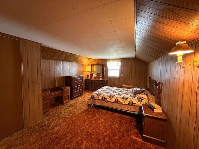 128 Munsterman St, Appleton, MN 56208 - bedroom featuring wooden walls, vaulted ceiling, and carpet flooring