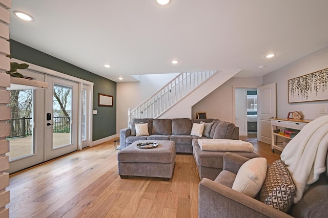 living area with stairway, recessed lighting, and light wood-style floors