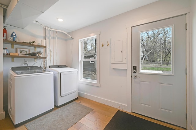 laundry room featuring laundry area, recessed lighting, washing machine and dryer, baseboards, and light wood-style floors