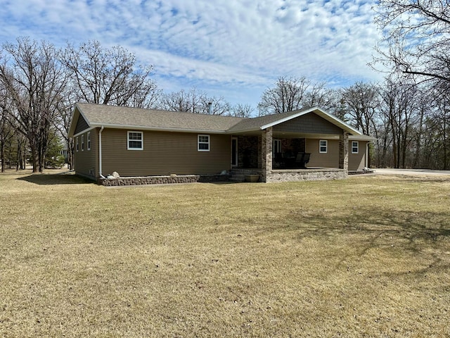 ranch-style house with a front lawn and a porch