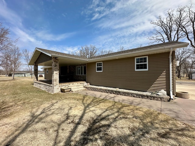 back of property with a porch