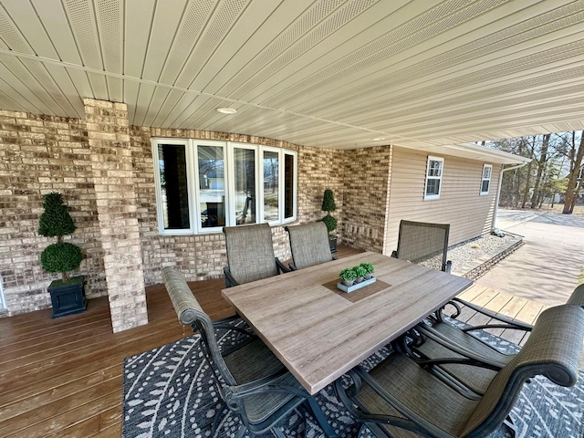 view of patio / terrace featuring outdoor dining space and a deck