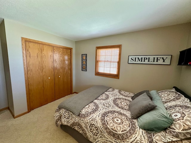 carpeted bedroom with a closet