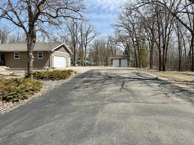 view of road with aphalt driveway