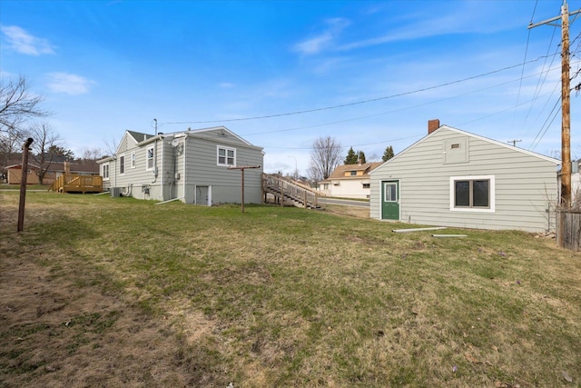 view of yard featuring stairway and a wooden deck
