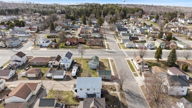 birds eye view of property with a residential view