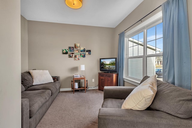 living room featuring carpet floors and baseboards