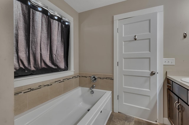 bathroom featuring a bath and vanity