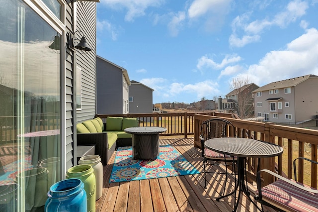 deck with outdoor lounge area and a residential view