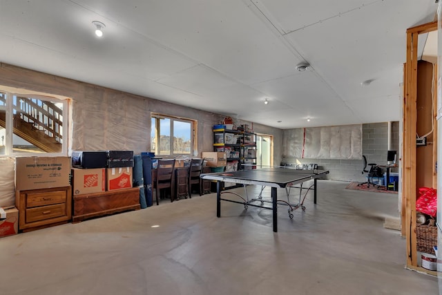 playroom featuring finished concrete floors