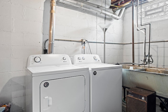 laundry room featuring washer and dryer and laundry area