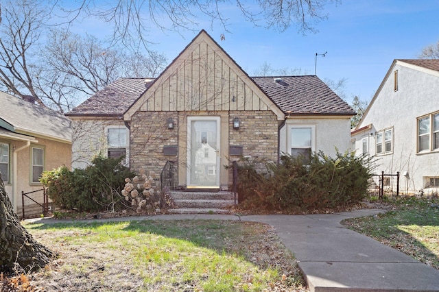46324634 Cedar Ave S, Minneapolis, MN 55407 - view of front of home with fence, stucco siding, a shingled roof, and stone siding